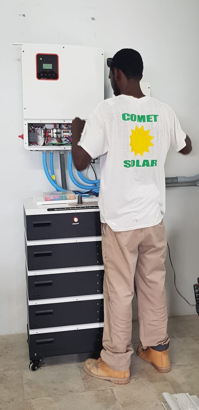 Comet Solar technician installing battery storage system